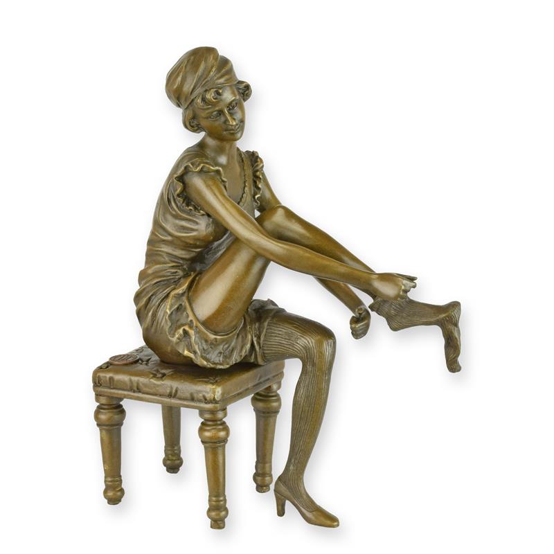 A\u0020BRONZE\u0020SCULPTURE\u0020OF\u0020A\u0020WOMAN\u0020PUTTING\u0020ON\u0020HER\u0020SOCKS