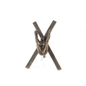AN EROTIC BRONZE SCULPTURE OF A WOMAN CHAINED TO A CROSS
