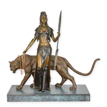 A BRONZE SCULPTURE OF A WOMAN WITH A TIGER