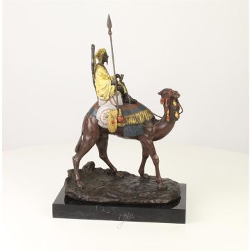 A BRONZE SCULPTURE OF A DROMEDARY AND RIDER