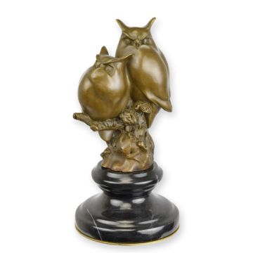A BRONZE SCULPTURE OF TWO OWLS SITTING ON A BRANCH (BRASS PL