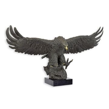 A BRONZE SCULPTURE OF A DESCENDING EAGLE