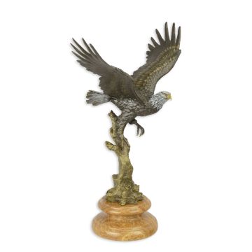 A BRONZE SCULPTURE OF AN EAGLE IN A FLIGHT