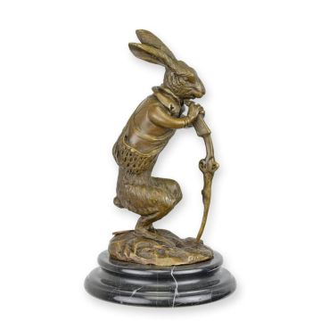 A BRONZE SCULPTURE OF A HUNTING HARE