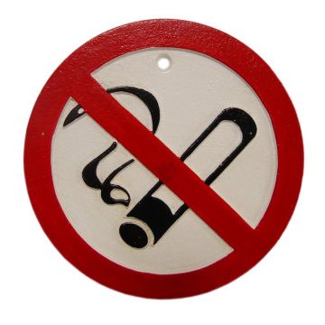A CAST IRON "NO SMOKING" SIGN