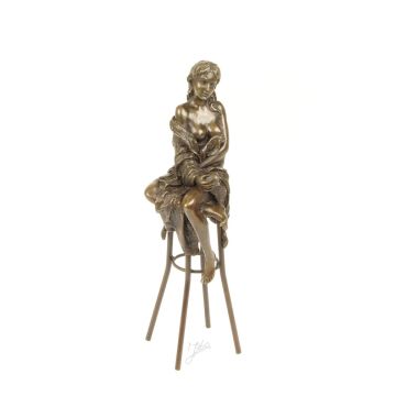 A BRONZE SCULPTURE OF A LADY ON BARCHAIR