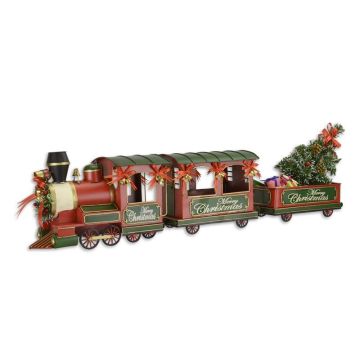 A TIN MODEL OF A CHRISTMAS LOCOMOTIVE WITH 2 WAGONS