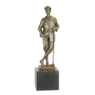 A BRONZE SCULPTURE OF A GOLFER