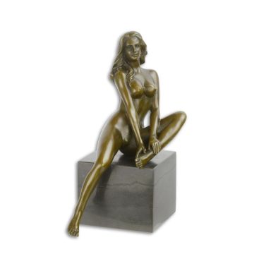 AN EROTIC BRONZE SCULPTURE OF A FEMALE NUDE