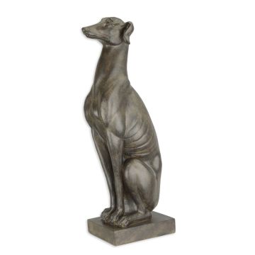 A RESIN FIGURINE OF A SITTING GREYHOUND