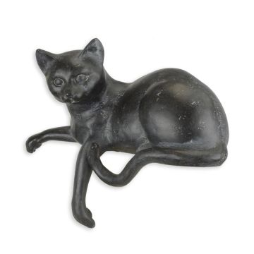 A RESIN FIGURINE OF A RECLINING CAT