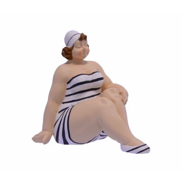 A RESIN FIGURINE OF A WOMAN IN SWIMSUIT