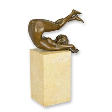 A BRONZE SCULPTURE OF A RECLINING FEMALE NUDE