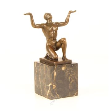 A BRONZE SCULPTURE OF A KNEELING MALE NUDE
