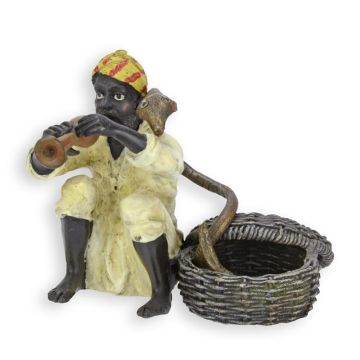 A BRONZE SCULPTURE OF A SNAKE CHARMER
