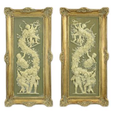 A PAIR OF FRAMED RESIN PLAQUES