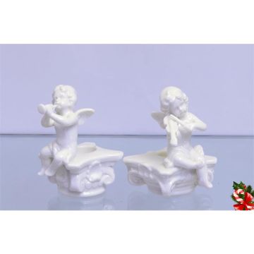 A PAIR OF FIGURAL CANDLE HOLDERS
