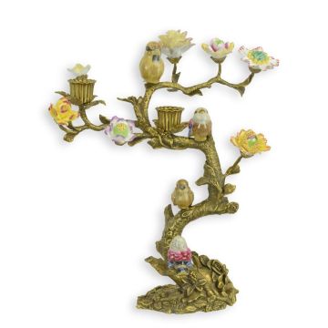A BRONZE CANDLE STAND MOUNTED WITH PORCELAIN BIRDS