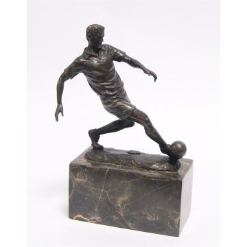 A BRONZE SCULPTURE OF A SOCCER PLAYER