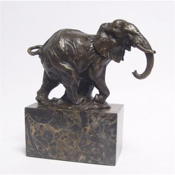 A BRONZE SCULPTURE OF A WALKING ELEPHANT
