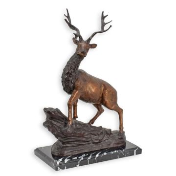 A BRONZE SCULPTURE OF A DEER ON A MARBLE BASE