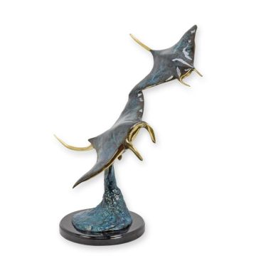 A BRONZE SCULPTURE OF TWO MANTAS ON A MARBLE BASE