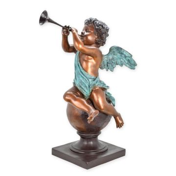 A BRONZE SCULPTURE CUPID SITTING ON A BALL PLAYING FLUTE