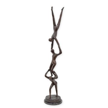 A BRONZE SCULPTURE OF A GROUP OF ACROBATS
