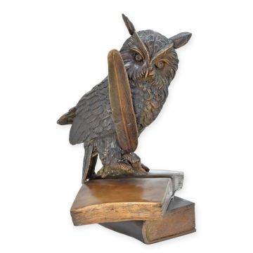 A BRONZE SCULPTURE OF THE WISE OWL WITH BOOKS