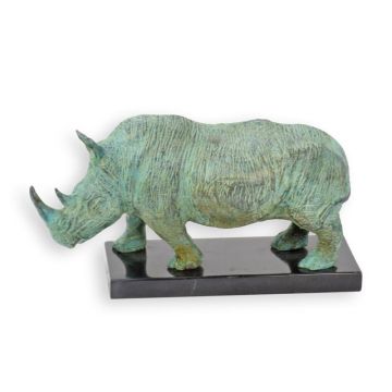 A BRONZE SCULPTURE OF A STANDING RHINO ON A MARBLE BASE