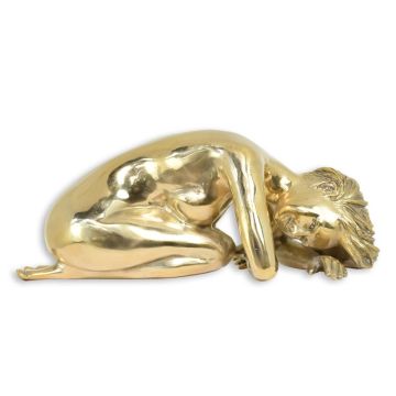 A BRONZE SCULPTURE OF A LYING FEMALE NUDE