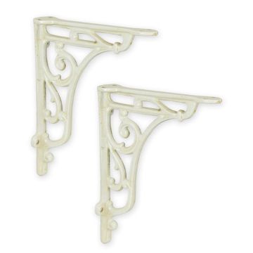 A PAIR OF CAST IRON WALL BRACKETS, OLD WHITE