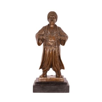 A BRONZE SCULPTURE OF A COSSACK