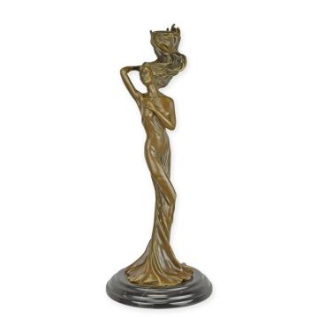 A FIGURAL BRONZE CANDLESTICK