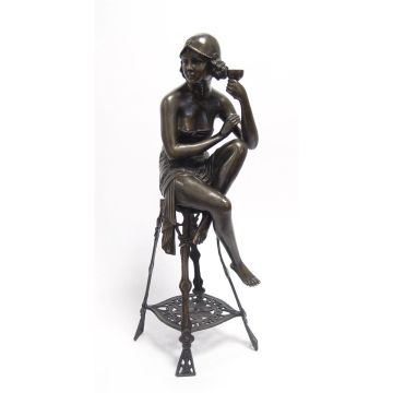 A BRONZE SCULPTURE OF THE CHAMPAGNE LADY