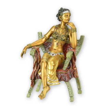 A BRONZE SCULPTURE OF A WOMAN IN A CURULE CHAIR