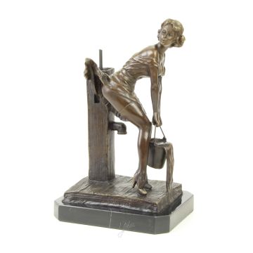 AN EROTIC BRONZE SCULPTURE OF A YOUNG LADY AT THE WATER PUMP